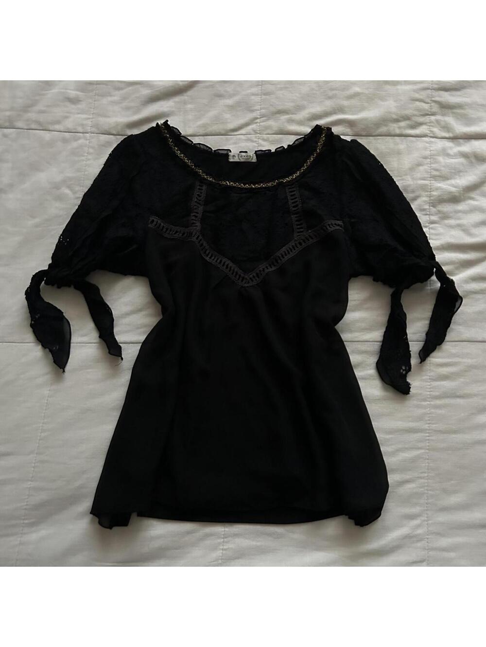 Axes Femme black top featuring delicate lace panel details